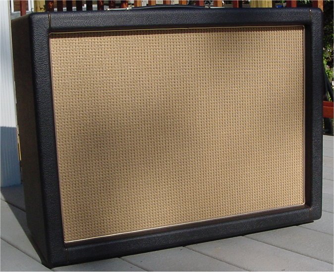 Black Levant cabinet with basketweave cane grille cloth